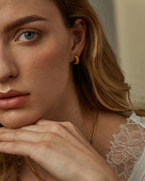 ALAIA CROISSANT HUGGIE HOOPS