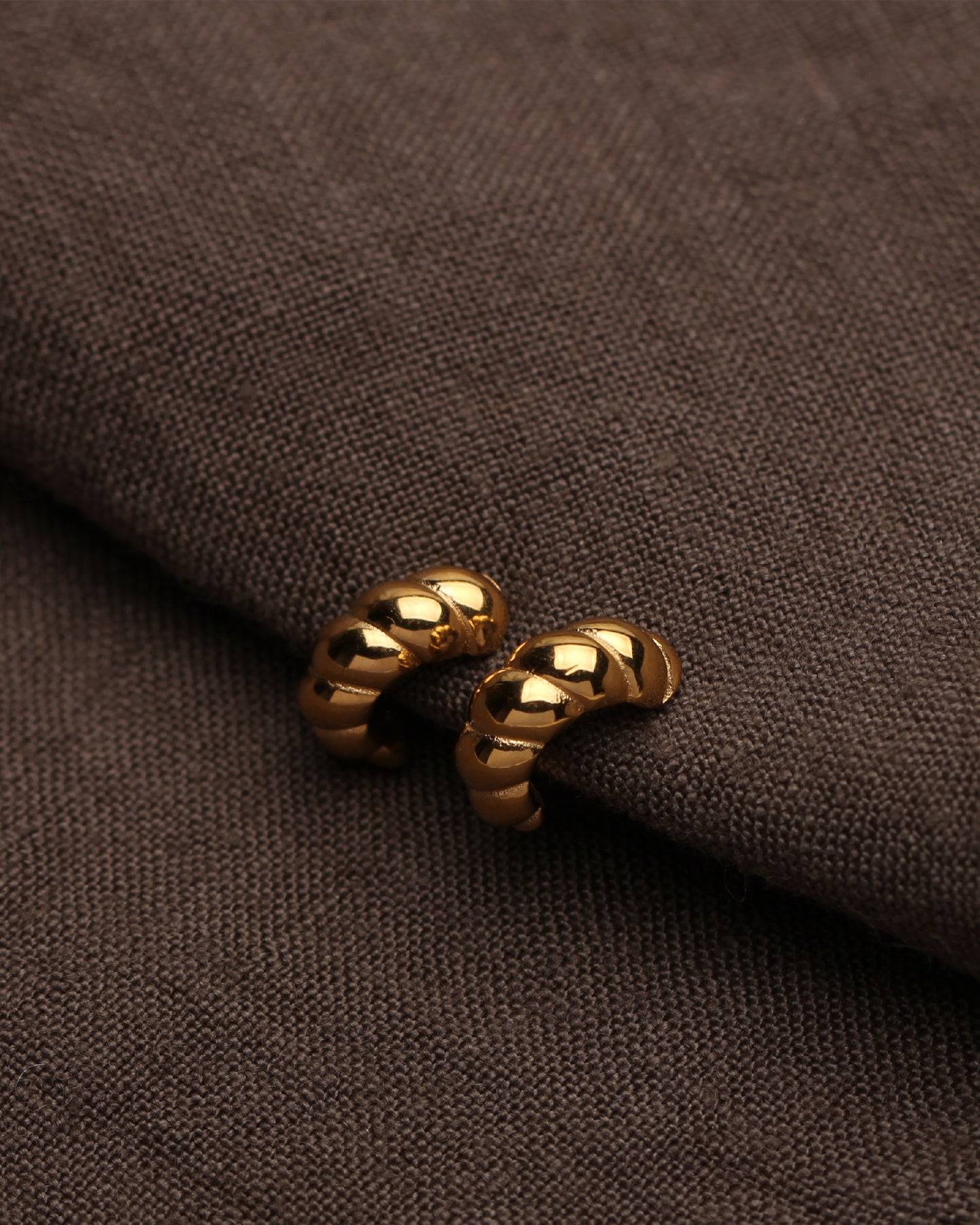 ALAIA CROISSANT HUGGIE HOOPS