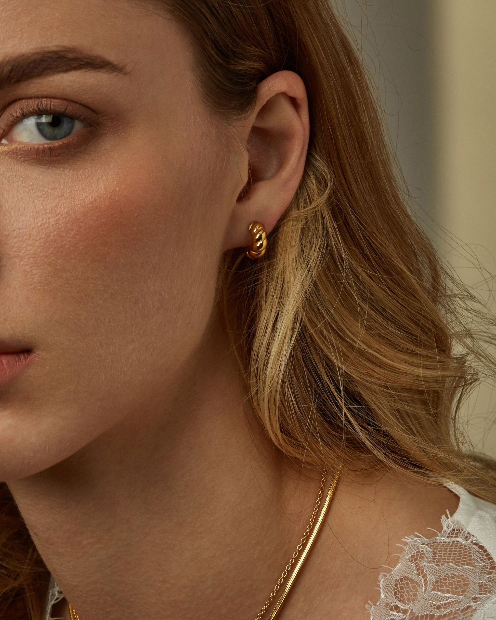 ALAIA CROISSANT HUGGIE HOOPS